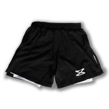 Black Fundamental MMA shorts back view - high split design for maximum mobility in BJJ training
